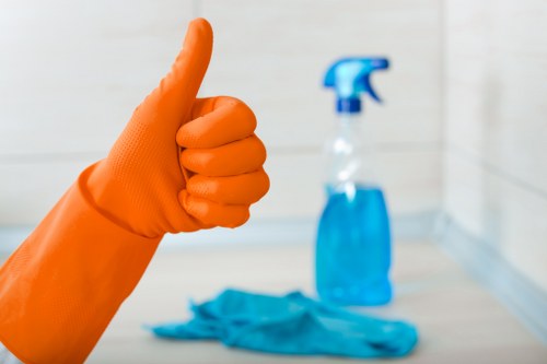 Technician preparing a carpet for steam cleaning in a home